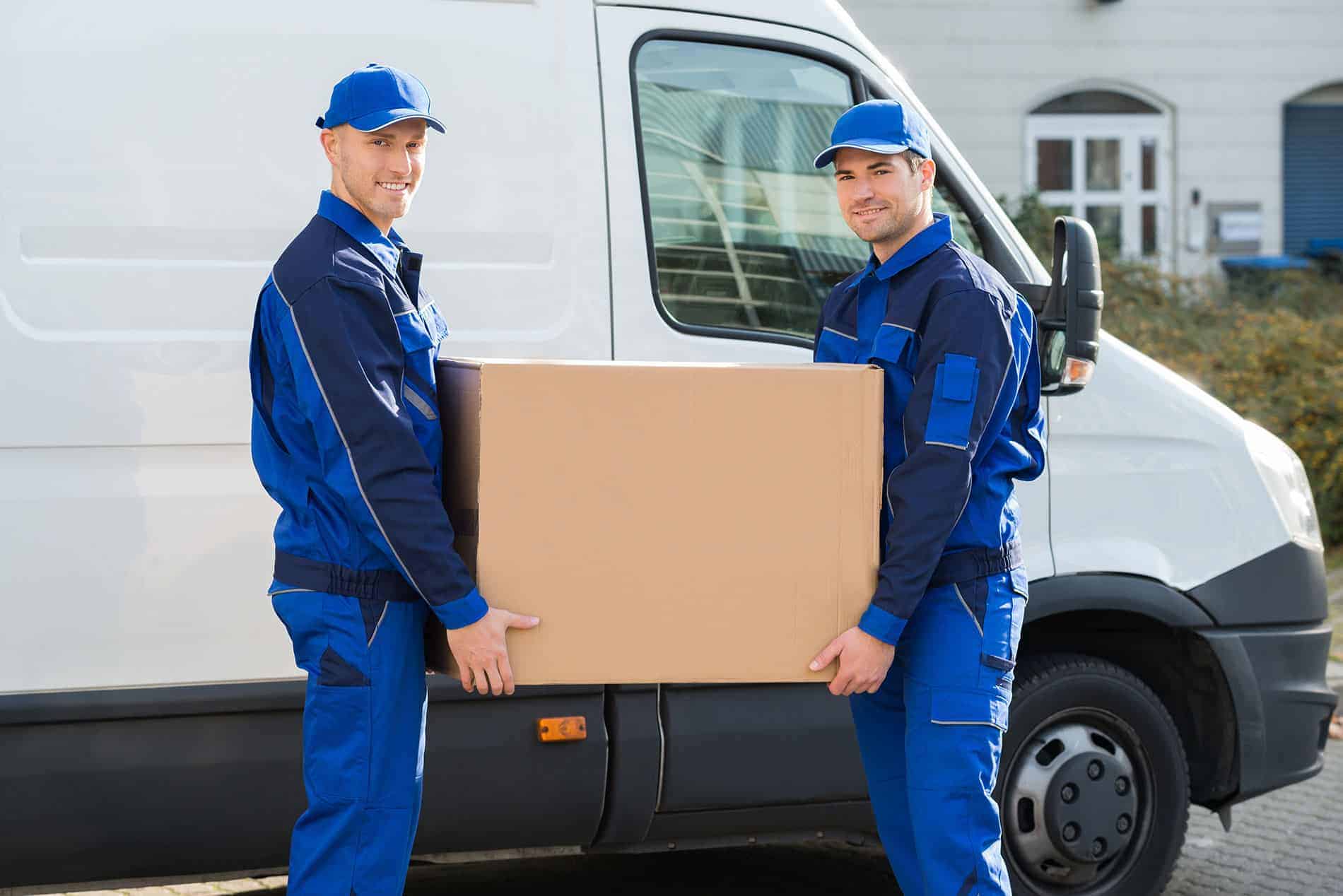 Removalists safely transporting a box from the warehouse