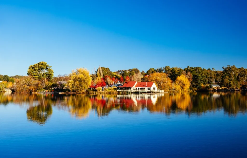 Scenic lake view in Daylesford with autumn trees and waterfront houses in Victoria Australia.